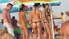 Hot bikini clad babes at the beach Thumb